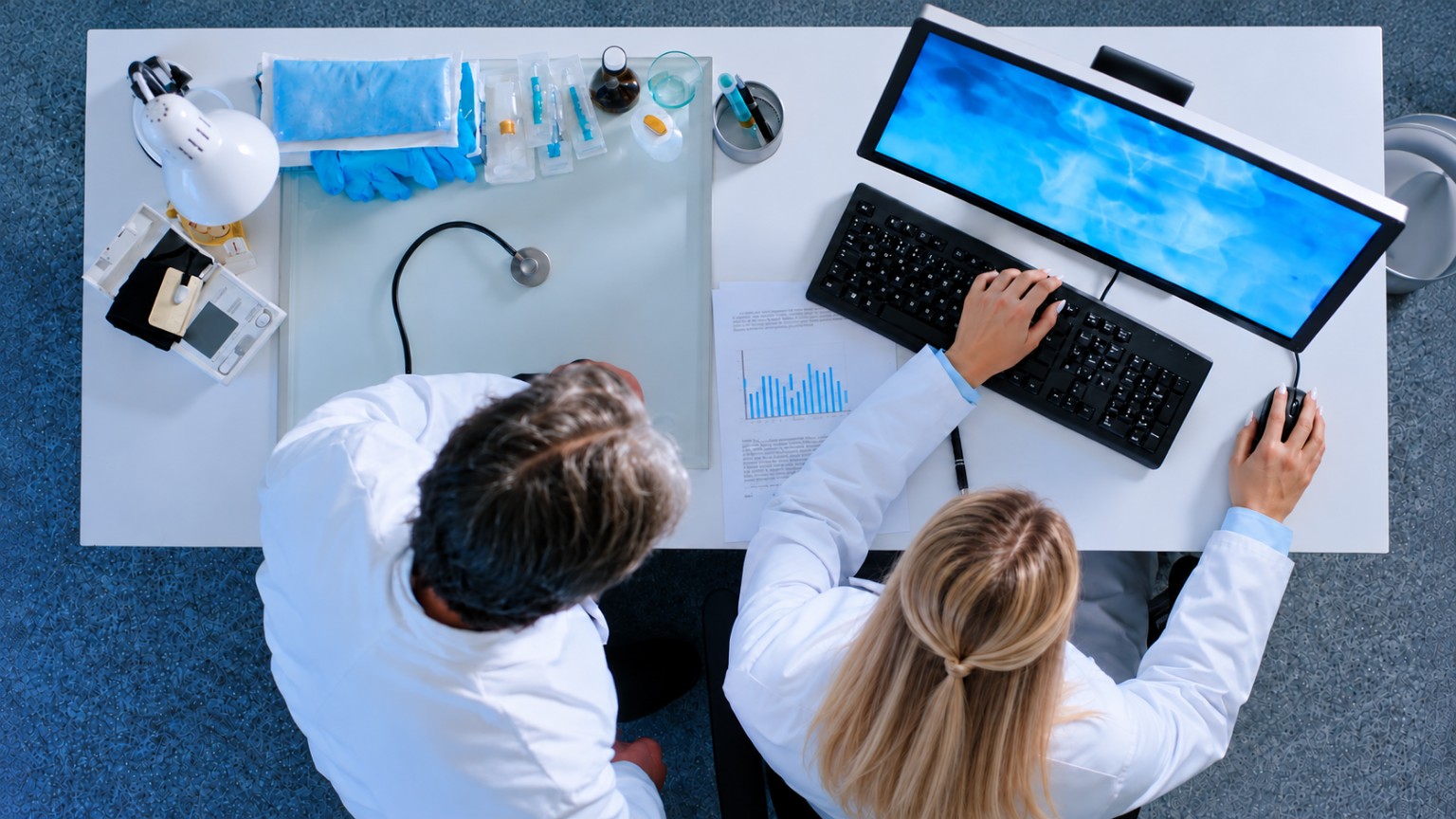 Medical professionals at a clinical workstation